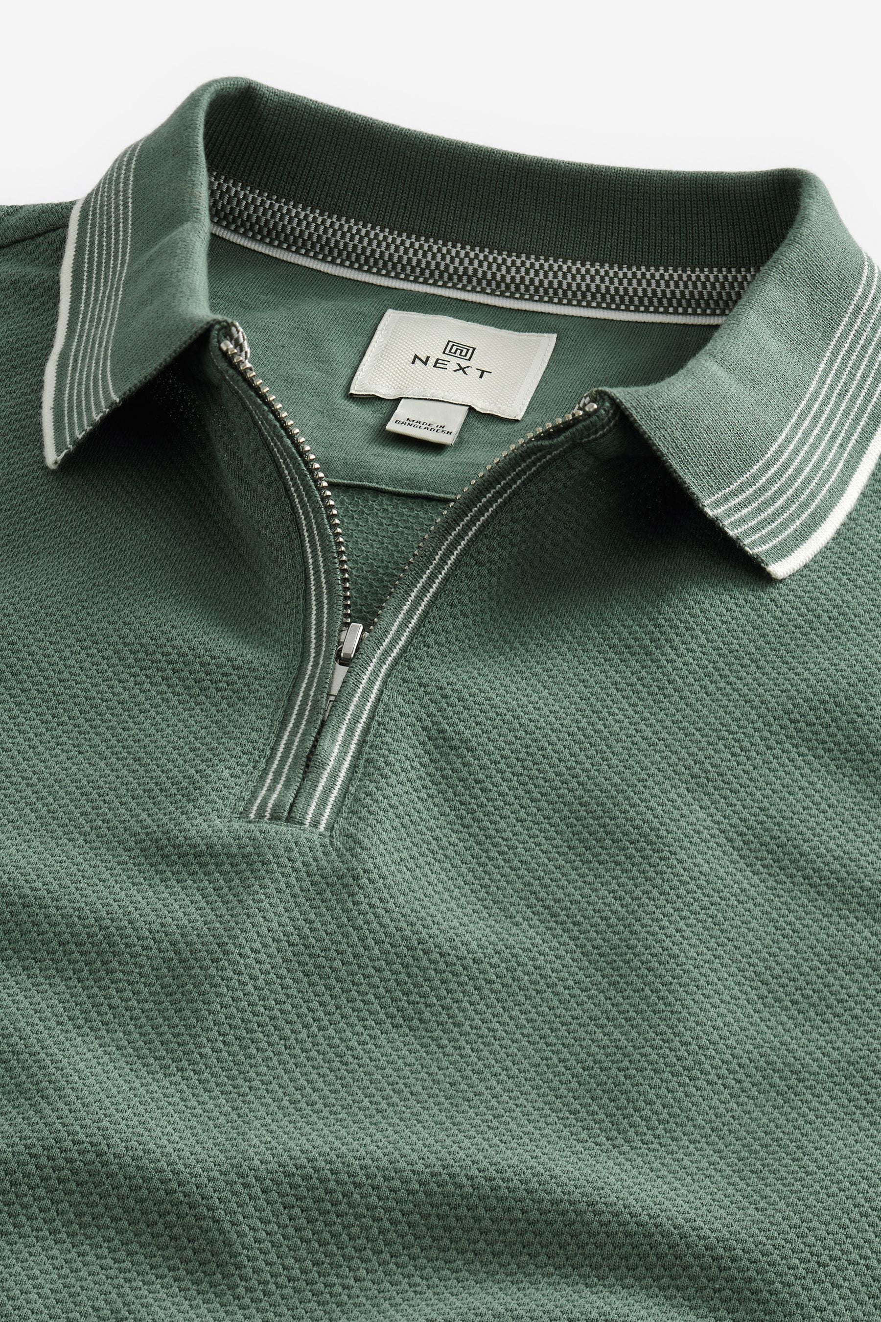 Buy Sage Green Tipped Textured Polo Shirt from the Next UK online shop