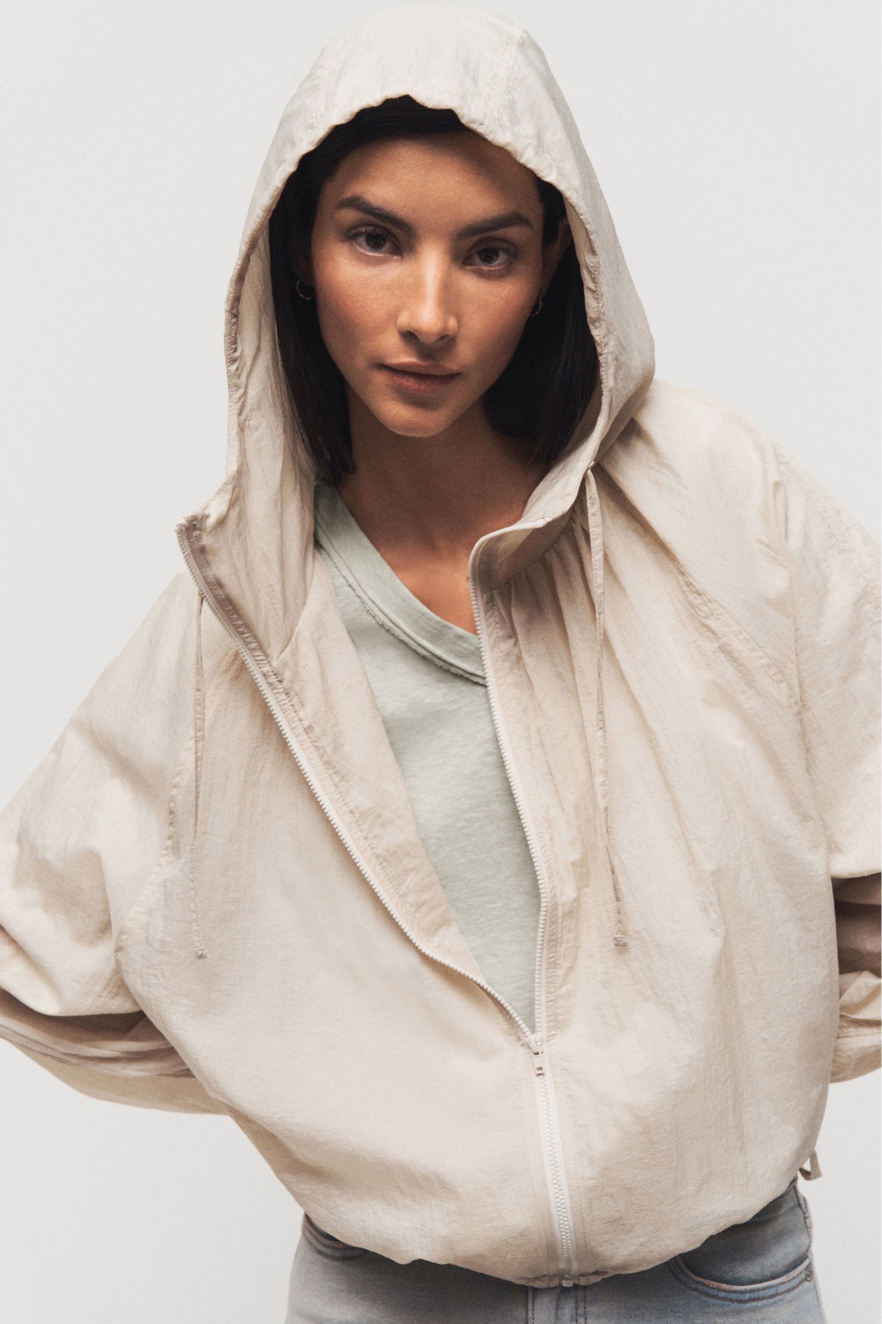 Buy Beige Sheer Shower Proof Raincoat from the Next UK online shop