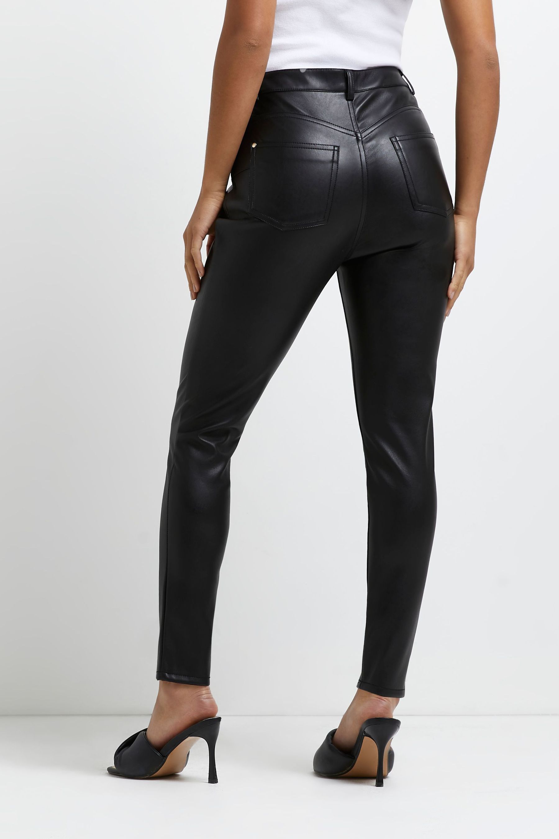 Buy River Island Black Petite Faux Leather Bum Sculpt Trousers from the ...
