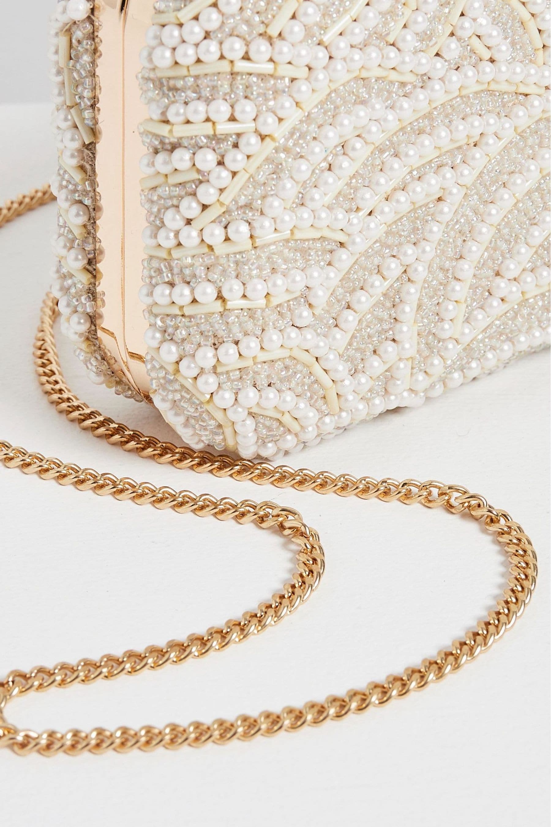 Buy Oliver Bonas Cream Pearl Clutch Bag from Next Ireland