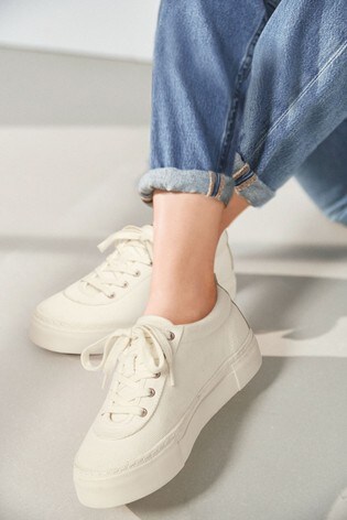 white canvas lace up trainers