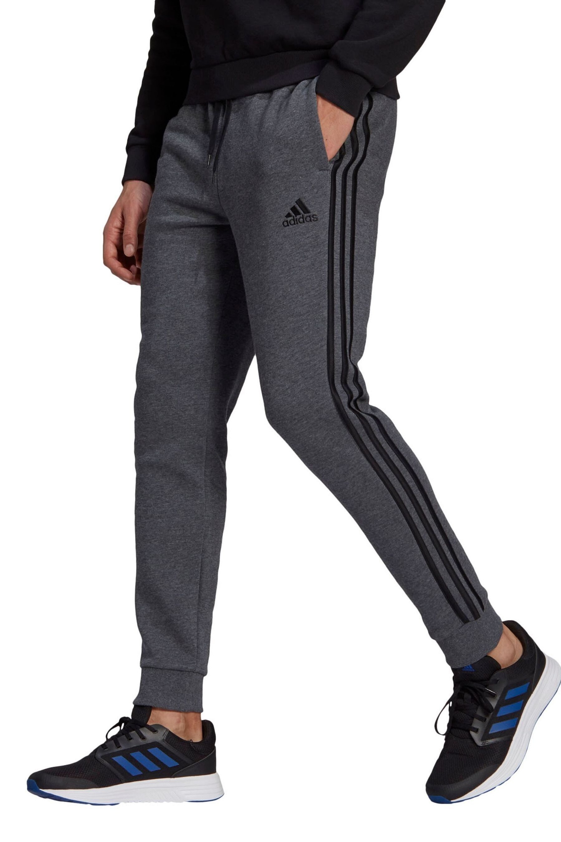 Grey adidas sweatpants with black stripes sale