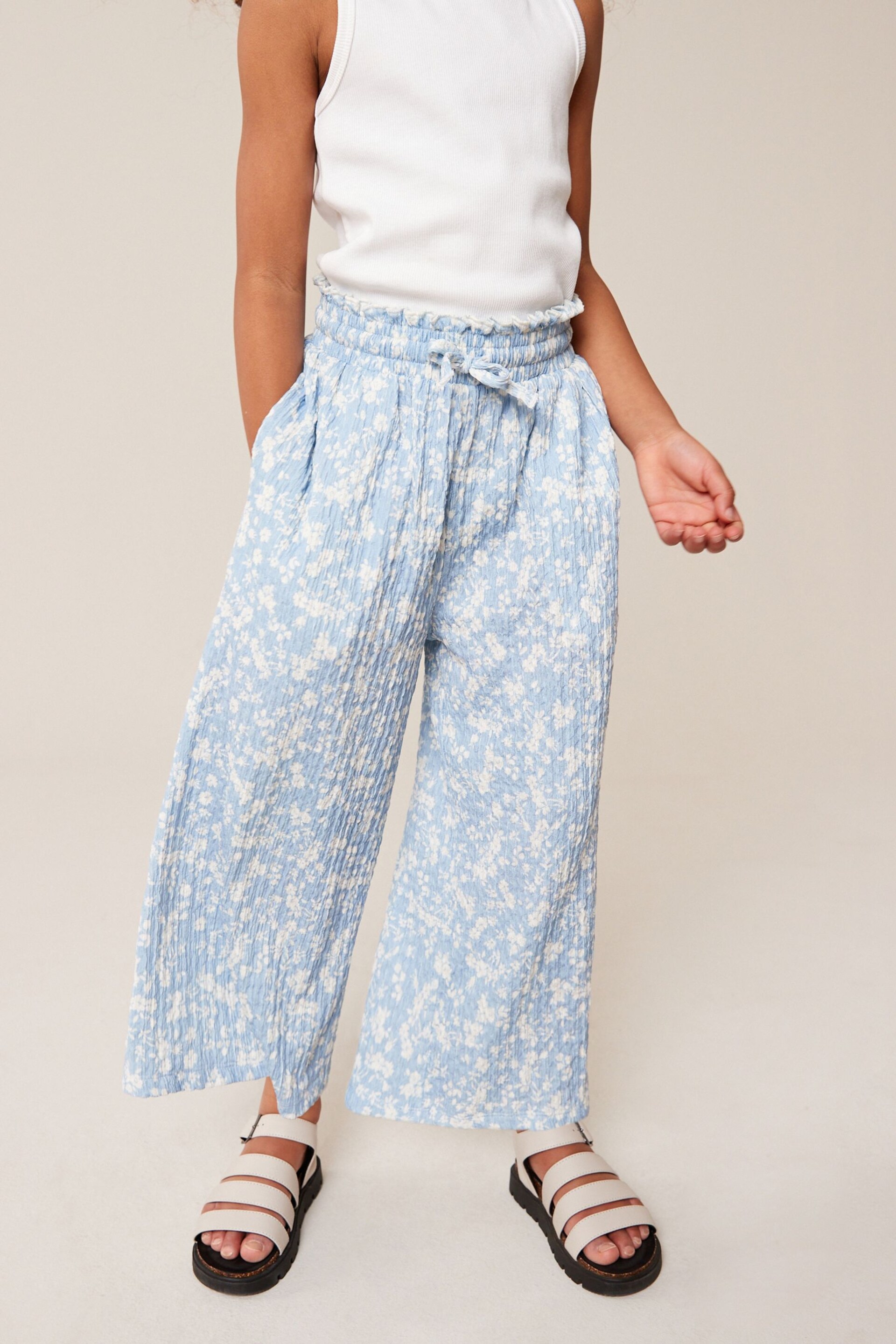 Blue/ White Floral Print Crinkle Texture Jersey Wide Leg Trousers (3-16yrs) - Image 1 of 6