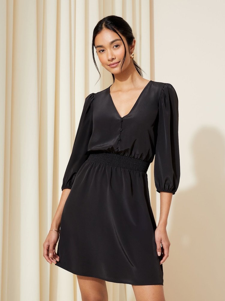 Friends Like These Black Shirred Waist 3/4 Sleeve Mini Dress - Image 1 of 4 Friends Like These Black Shirred Waist 3/4 Sleeve Mini Dress - Image 1 of 4