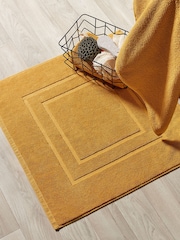 Christy Saffron Yellow Brixton 850GSM 100% Cotton Bath Mat - Image 1 of 2