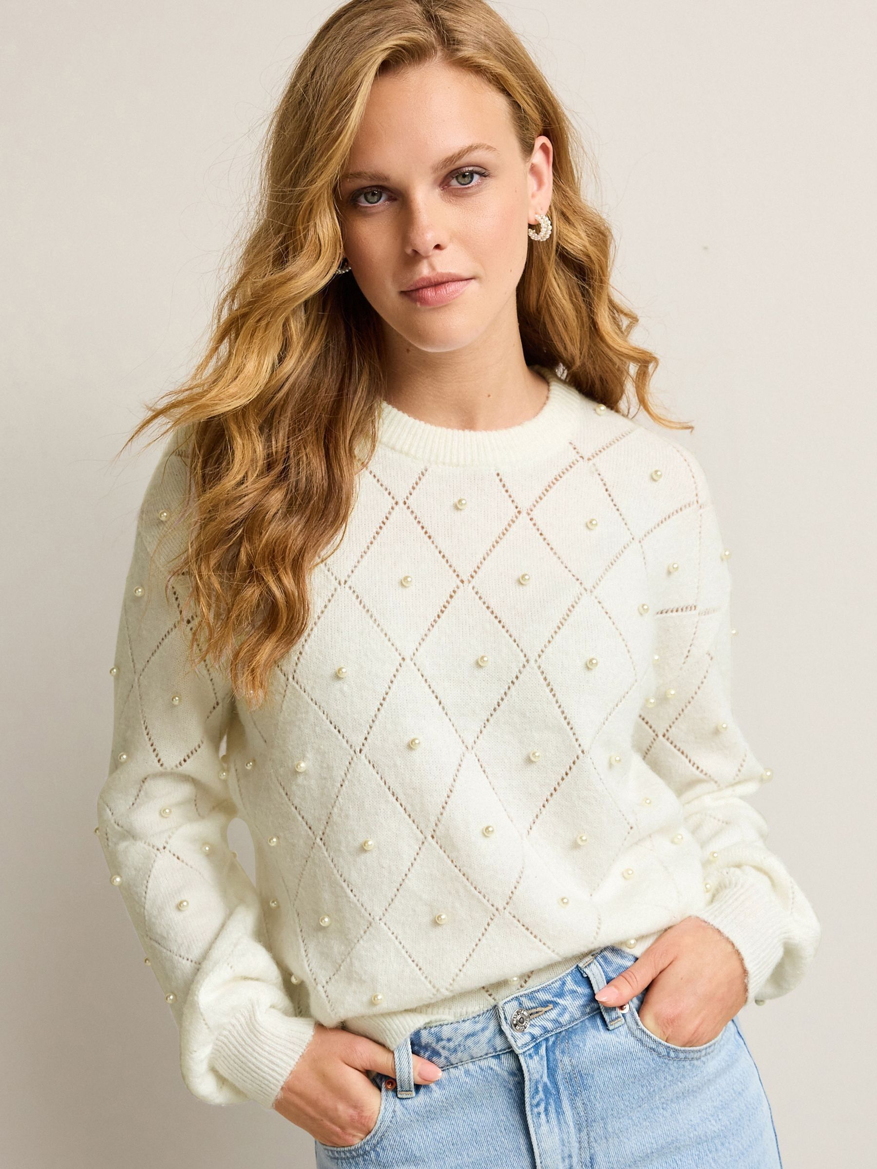 White jumper with pearls top