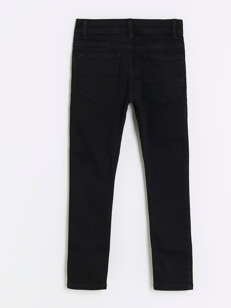 Schwarz - River Island – Skinny-Jeans für Jungen aus 100 % Baumwolle - Bild 2 von 4 Schwarz - River Island – Skinny-Jeans für Jungen aus 100 % Baumwolle - Bild 2 von 4