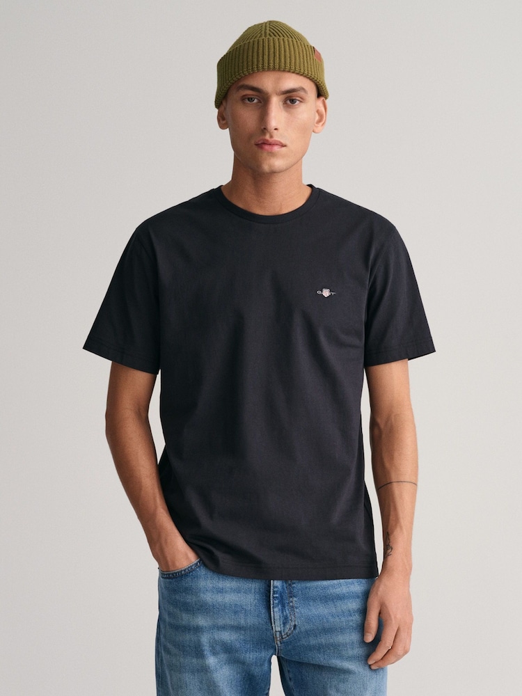 Schwarz - GANT – T-Shirt mit 100 % Baumwolle und Shield-Logo - Bild 1 von 5 Schwarz - GANT – T-Shirt mit 100 % Baumwolle und Shield-Logo - Bild 1 von 5