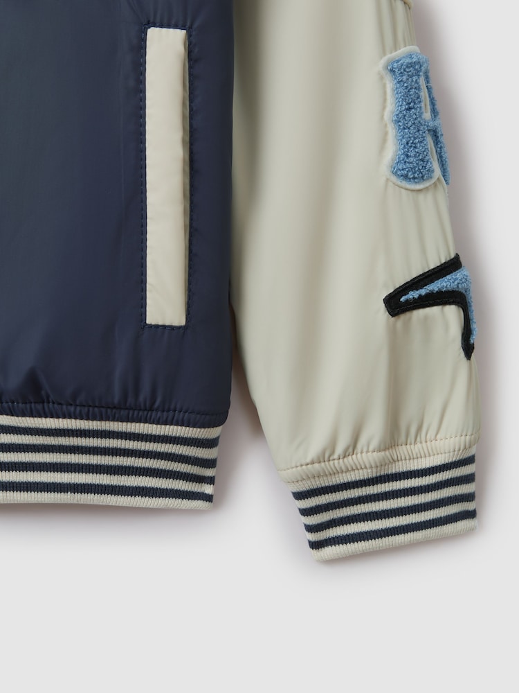 Reiss x McLaren F1 Team Airforce Blue/Ecru Junior McLaren F1 Patch Varsity Bomber Jacket - Image 12 of 12 Reiss x McLaren F1 Team Airforce Blue/Ecru Junior McLaren F1 Patch Varsity Bomber Jacket - Image 12 of 12