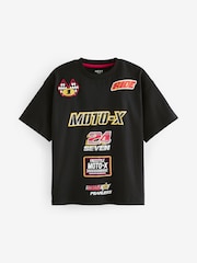 Schwarz, Motocross - Kurzärmeliges Grafik-T-Shirt in Oversized-Passform aus 100 % Baumwolle (3–16 J.) - Bild 1 von 3