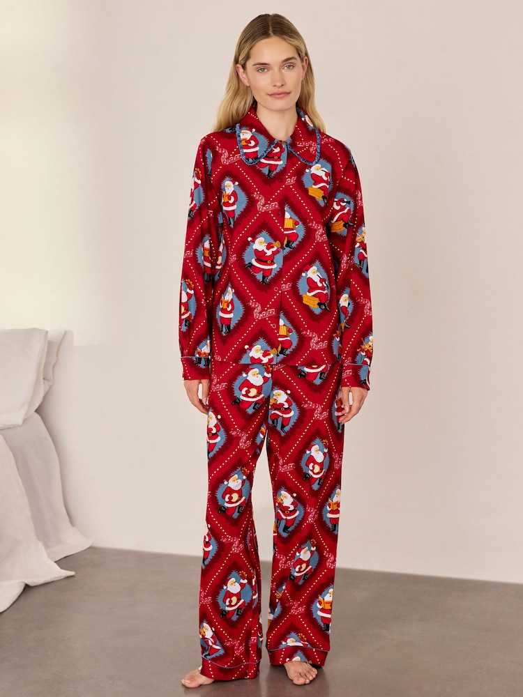 Conjunto de pijama largo de algodón con estampado navideño de Papá Noel con cancionero de Chelsea Peers - Imagen 1 de 7 Conjunto de pijama largo de algodón con estampado navideño de Papá Noel con cancionero de Chelsea Peers - Imagen 1 de 7
