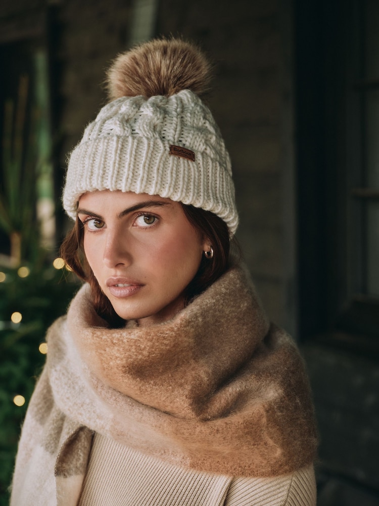 Barbour® Cream Penshaw Cable Knit Faux Fur Pom Beanie Logo Hat - Image 1 of 7