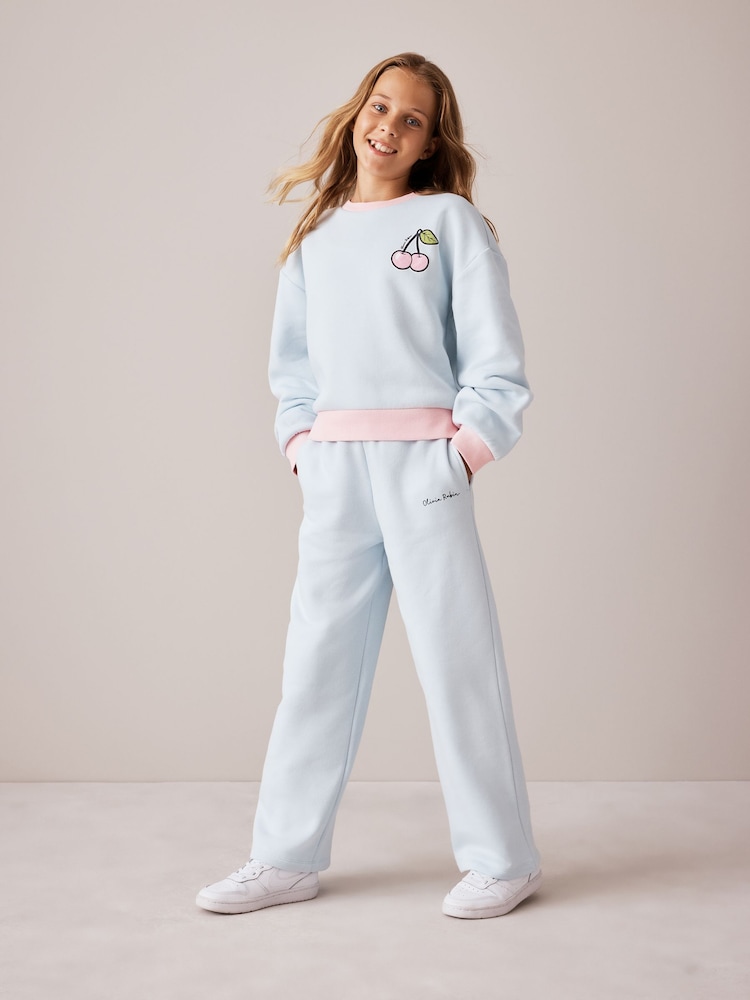 Olivia Rubin Blue Colour Block Cherry Sweat & Joggers Set 2 Piece - Image 1 of 6 Olivia Rubin Blue Colour Block Cherry Sweat & Joggers Set 2 Piece - Image 1 of 6