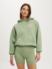 Zaļš - Cotton On Plush Premium Graphic Raglan kapučjakas - Attēls 5 no 5
