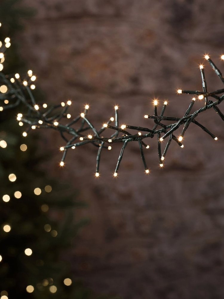 Lights4fun Green 10m 1000 LED Warm White Outdoor Cluster Fairy Lights Cable - Image 1 of 4 Lights4fun Green 10m 1000 LED Warm White Outdoor Cluster Fairy Lights Cable - Image 1 of 4