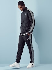 črna - adidas Tricot z izrazitim barvnim vzorcem trenirka - Slika 1 iz 6