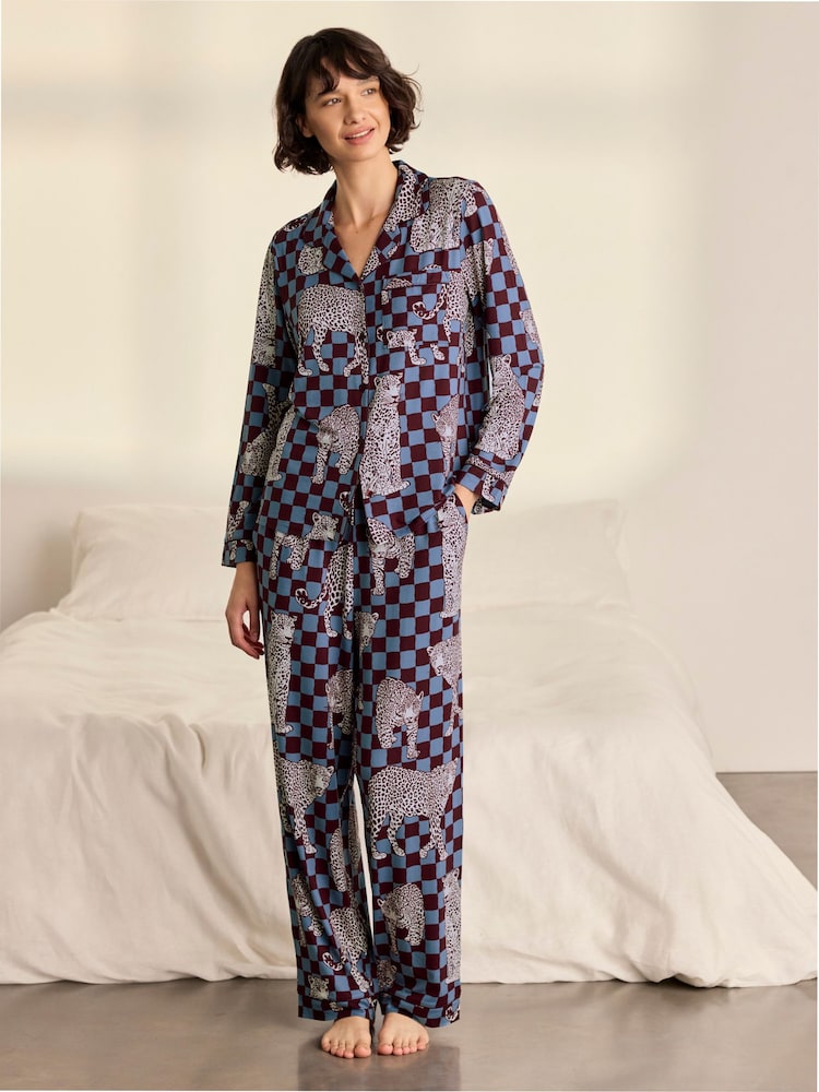 Chelsea Peers Blue Midnight Checkerboard Leopard Print Long Pyjamas Set - Image 1 of 8 Chelsea Peers Blue Midnight Checkerboard Leopard Print Long Pyjamas Set - Image 1 of 8