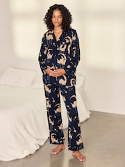 Conjunto de pijama largo con estampado de conejitos lunares y diseño abotonado de Chelsea Peers - Imagen 1 de 8