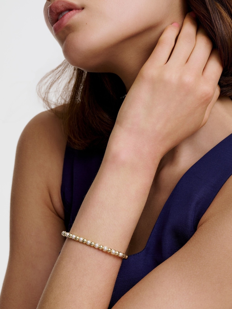 Karen Millen Gold Tone Logo Pearl Hinged Bangle - Image 1 of 6 Karen Millen Gold Tone Logo Pearl Hinged Bangle - Image 1 of 6