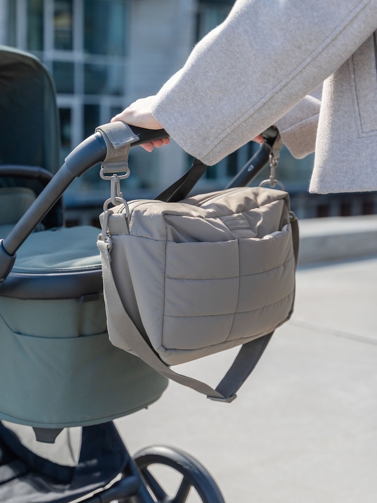 Done by Deer Taupe Quilted Stroller Bag with Pram Clips - Image 1 of 6 Done by Deer Taupe Quilted Stroller Bag with Pram Clips - Image 1 of 6