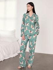 Conjunto de piyama larga de algodón con estampado de carrusel de caballos de Chelsea Peers - Imagen 1 de 7