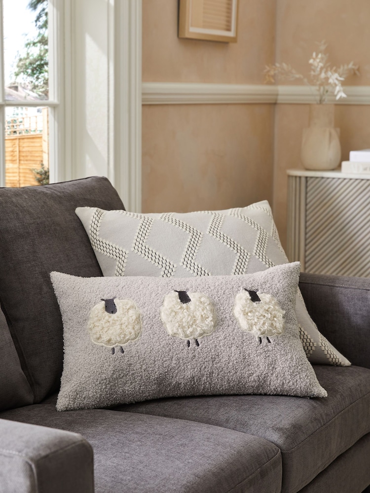 Grey 50 x 30cm Cosy Bouclé Textured Sheep Trio Cushion - Image 1 of 4