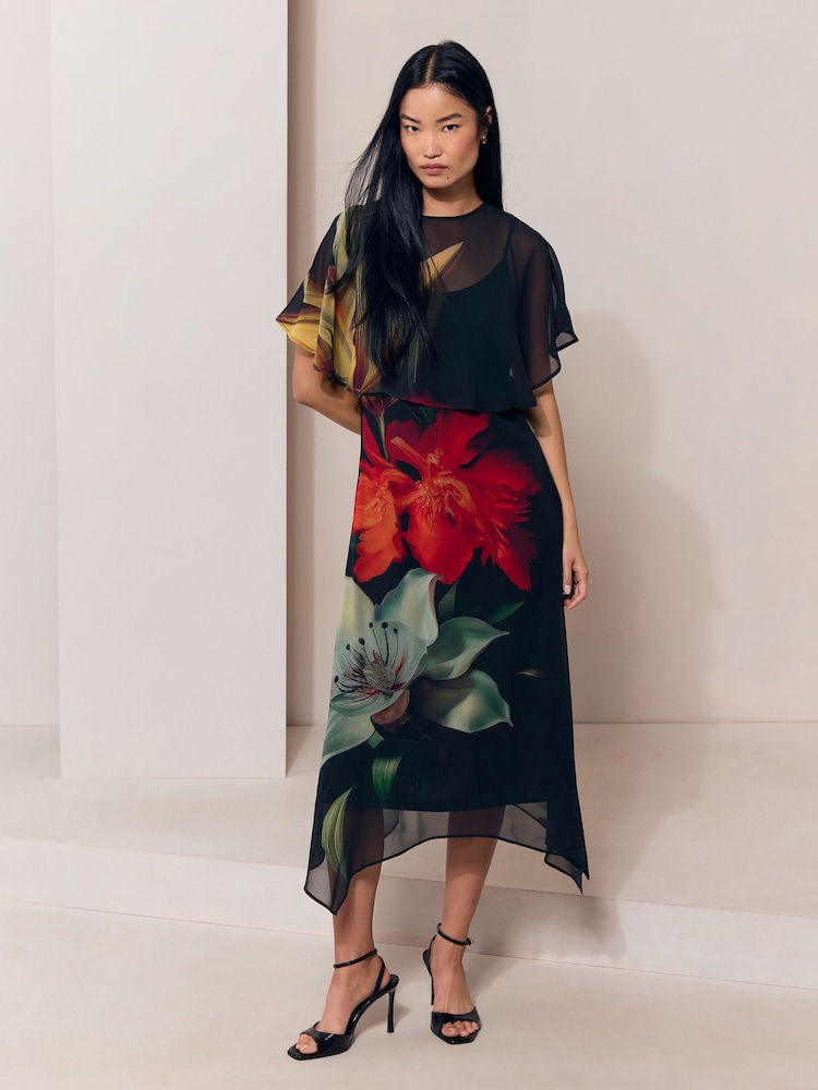 Black Floral Print Mesh Cape Hanky Hem Fit And Flare Maxi Dress - Image 1 of 5 Black Floral Print Mesh Cape Hanky Hem Fit And Flare Maxi Dress - Image 1 of 5