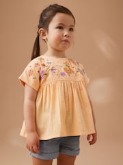 Pfirsich/Blumenstickerei - Kurzärmelige Bluse (3 Monate – 7 Jahre) - Bild 1 von 7