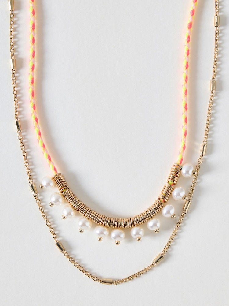 Oliver Bonas Yellow Amie Cord & Faux Pearl Double Row Necklace - Image 1 of 3 Oliver Bonas Yellow Amie Cord & Faux Pearl Double Row Necklace - Image 1 of 3