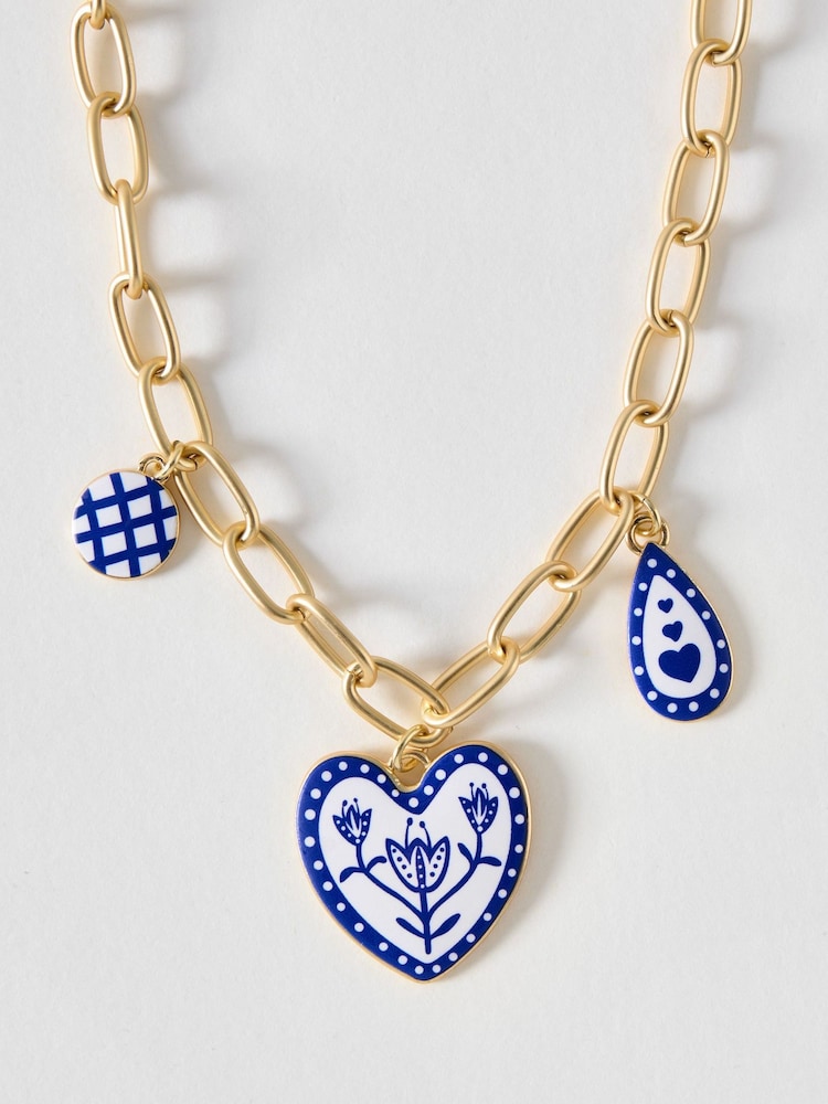 Oliver Bonas Blue Shirley Patterned Heart Charm Necklace - Image 1 of 3 Oliver Bonas Blue Shirley Patterned Heart Charm Necklace - Image 1 of 3