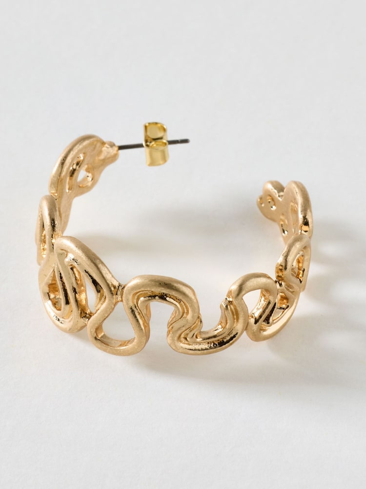 Oliver Bonas Gold Gladys Wavy Brushed Metal Hoop Earrings - Image 2 of 4 Oliver Bonas Gold Gladys Wavy Brushed Metal Hoop Earrings - Image 2 of 4
