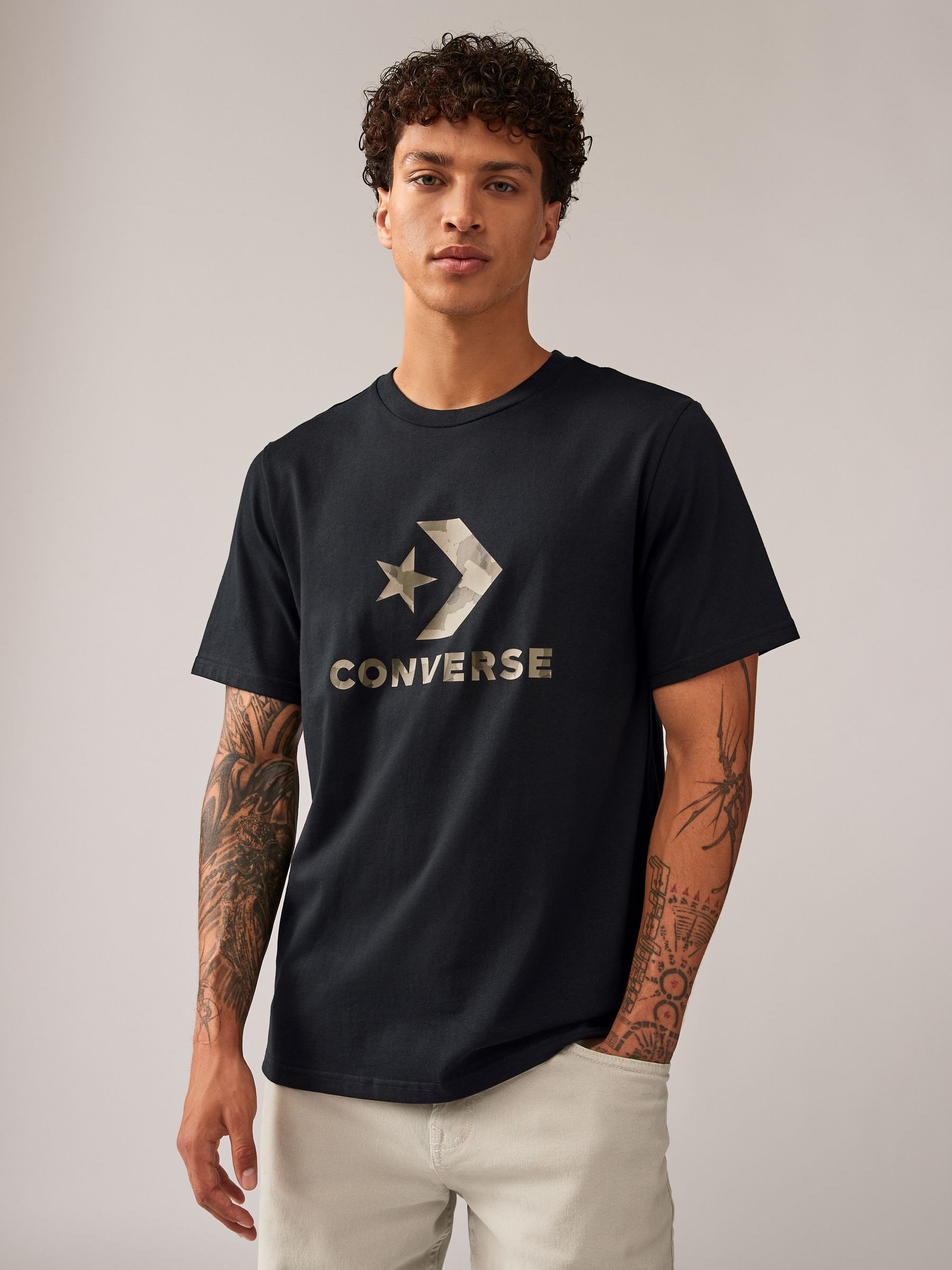 Converse with logo on outside store