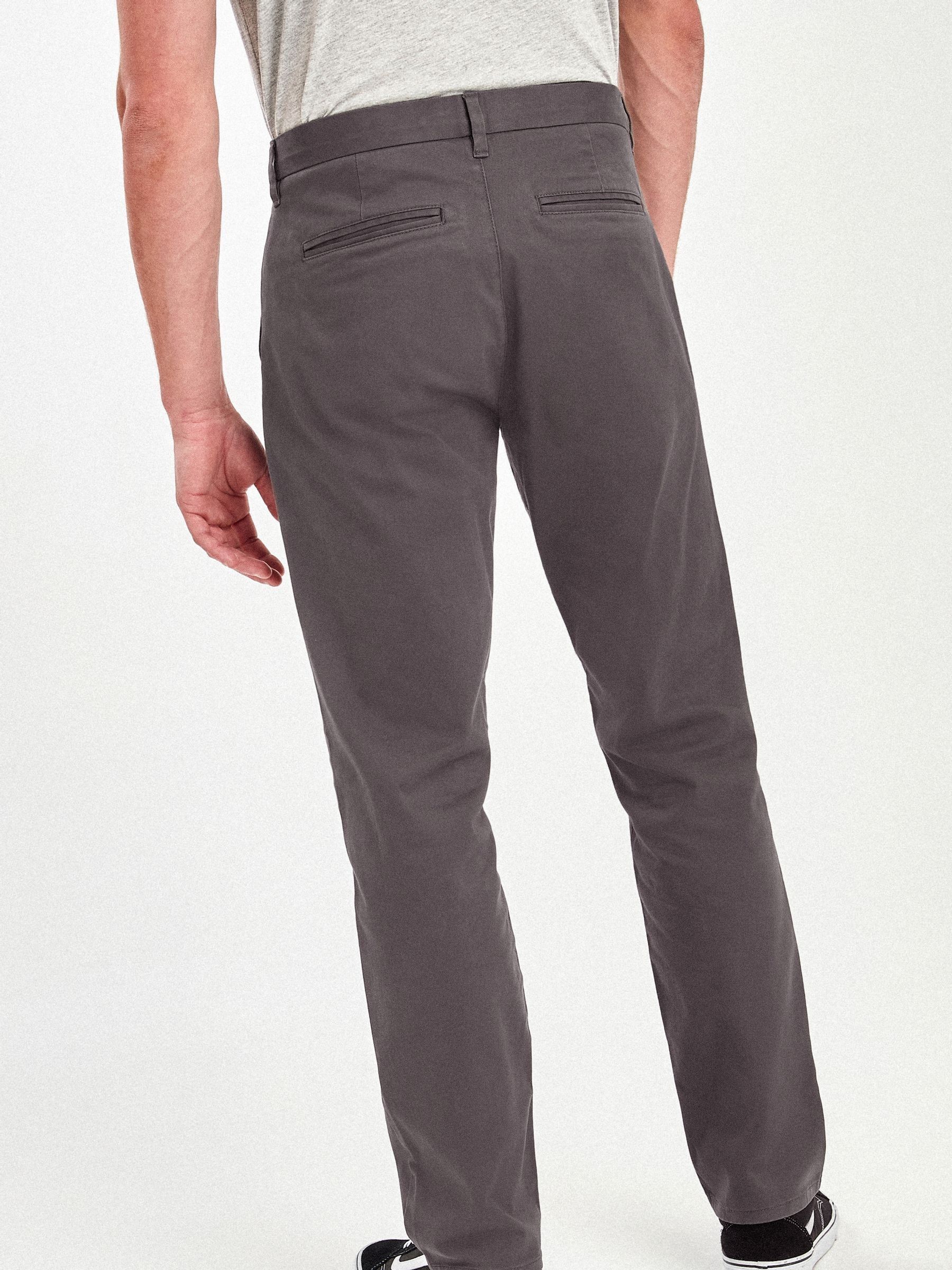 Buy Grey Dark Relaxed Fit Stretch Chino Trousers from Next USA