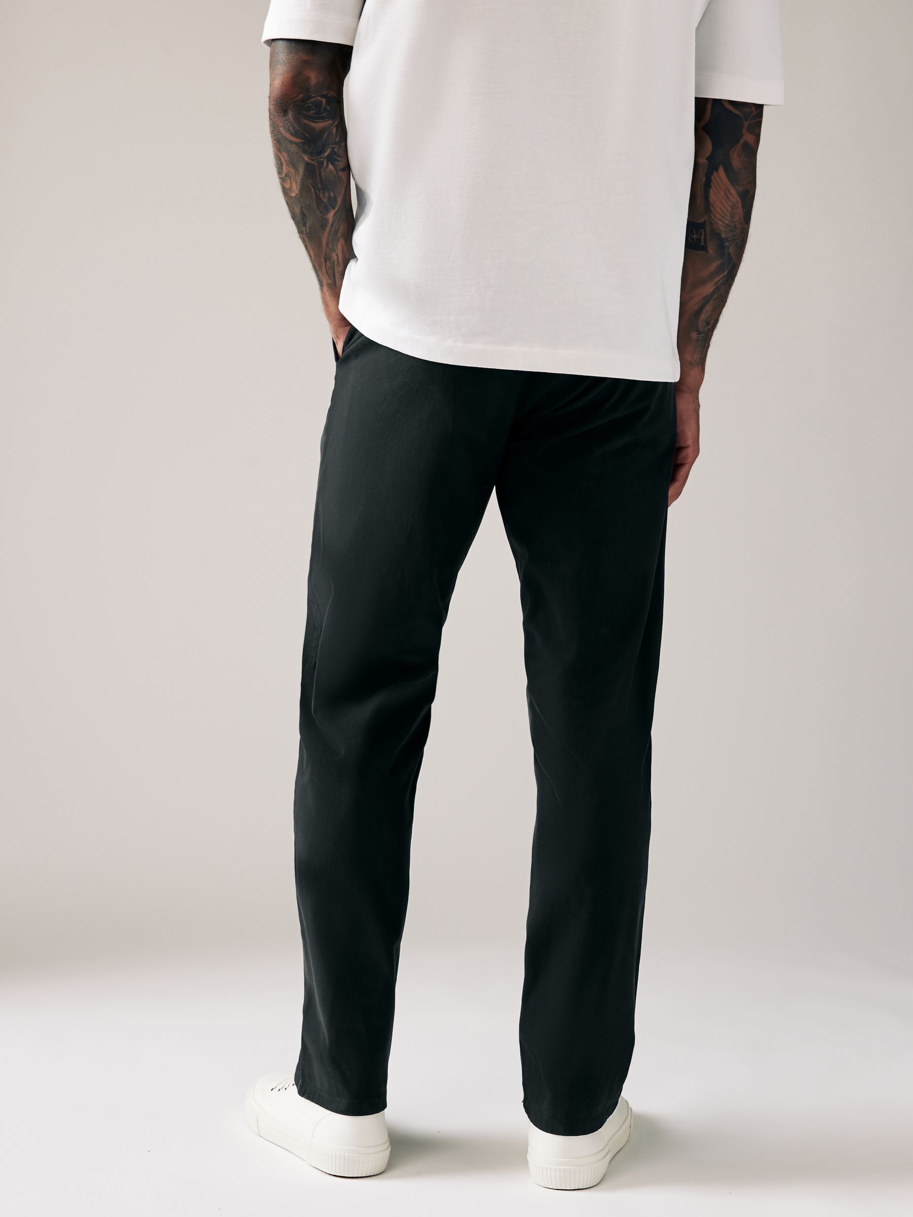 Buy Black Relaxed Fit Stretch Chinos Trousers from Next USA