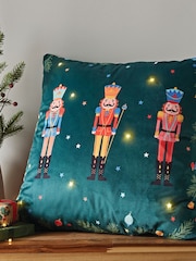 Catherine Lansfield Green Christmas Nutcracker Soft Velvet Light Up 45x45cm Cushion - Image 1 of 5