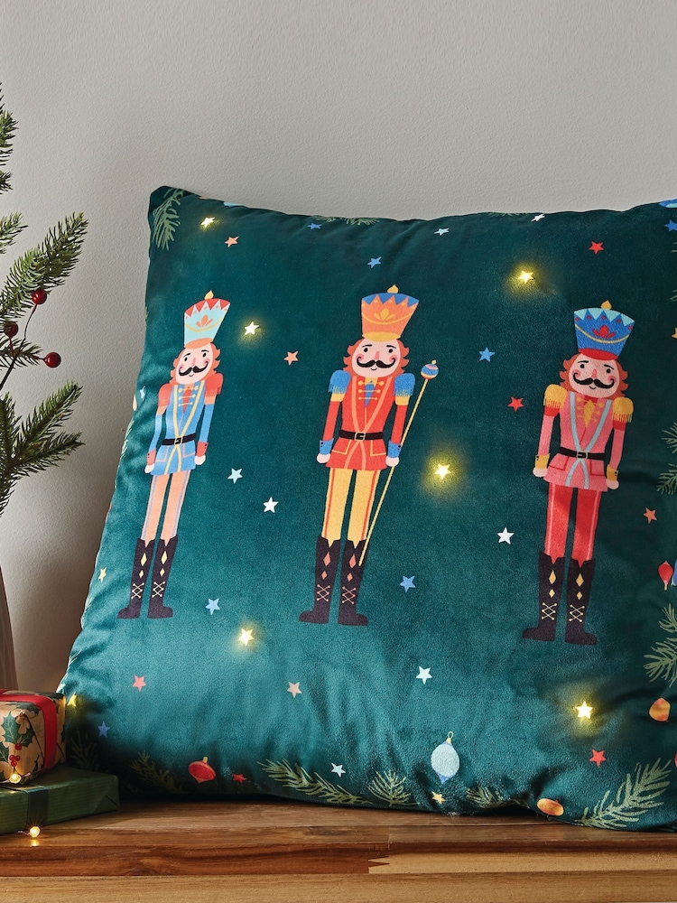 Catherine Lansfield Green Christmas Nutcracker Soft Velvet Light Up 45x45cm Cushion - Image 1 of 5