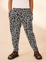 Schwarz/Weiß mit Blumenprint - Leichte Jerseyhose mit Stretch (3–16 Jahre) - Bild 3 von 7