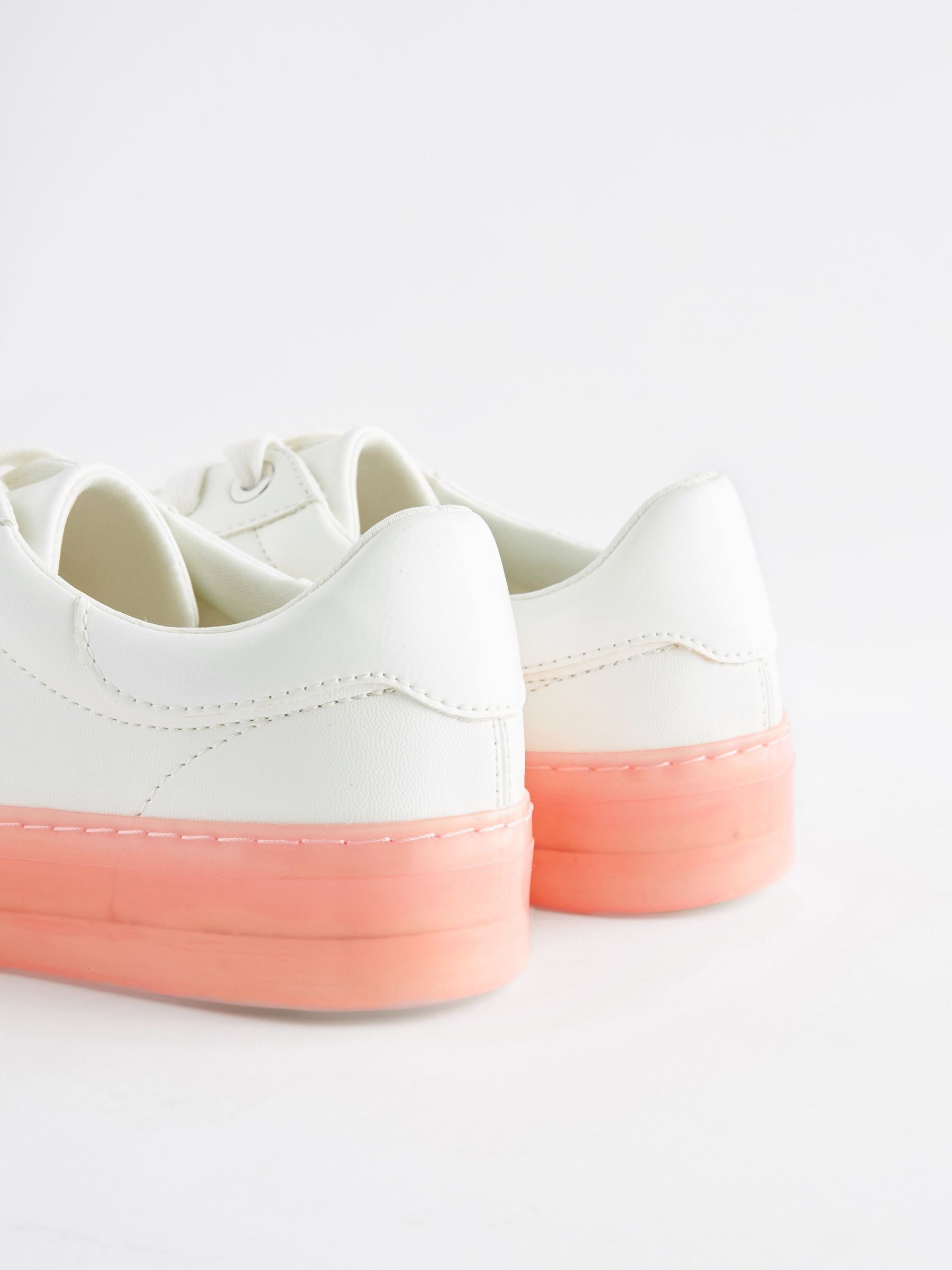 White sneakers with pink soles top