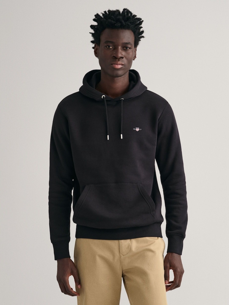 Schwarz - Gant Shield Kapuzensweatshirt in Regular Fit mit Logo - Bild 1 von 5 Schwarz - Gant Shield Kapuzensweatshirt in Regular Fit mit Logo - Bild 1 von 5