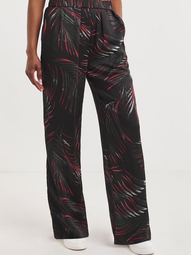 JD Williams Palm Print Satin Wide Leg Black Trousers - Image 1 of 5