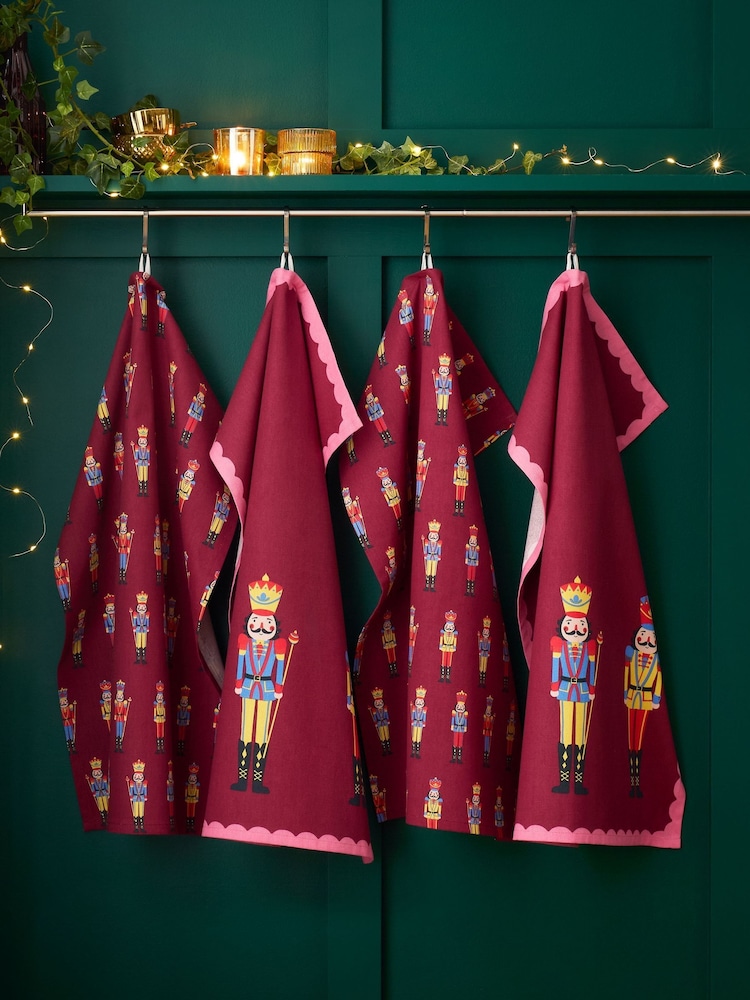 Catherine Lansfield 4 Pack Plum Christmas Nutcracker Kitchen Cotton Tea Towels - Image 1 of 2 Catherine Lansfield 4 Pack Plum Christmas Nutcracker Kitchen Cotton Tea Towels - Image 1 of 2