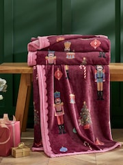 Catherine Lansfield Plum Teddy Christmas Nutcracker Cosy and Warm Fleece Throw - Image 1 of 3