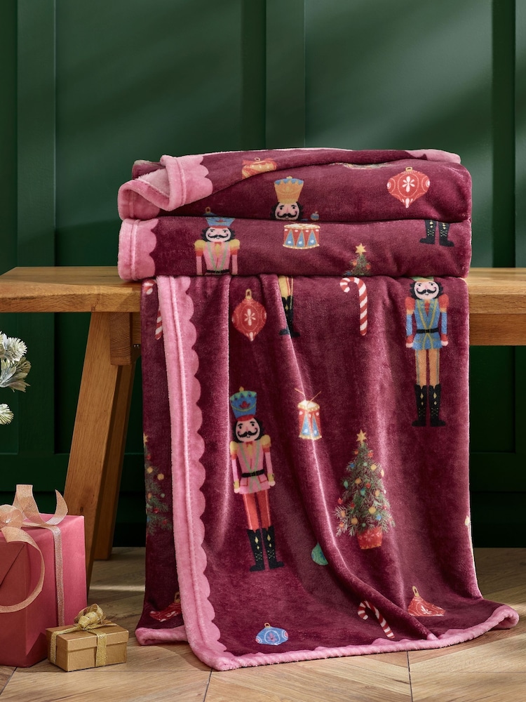 Catherine Lansfield Plum Teddy Christmas Nutcracker Cosy and Warm Fleece Throw - Image 1 of 3 Catherine Lansfield Plum Teddy Christmas Nutcracker Cosy and Warm Fleece Throw - Image 1 of 3