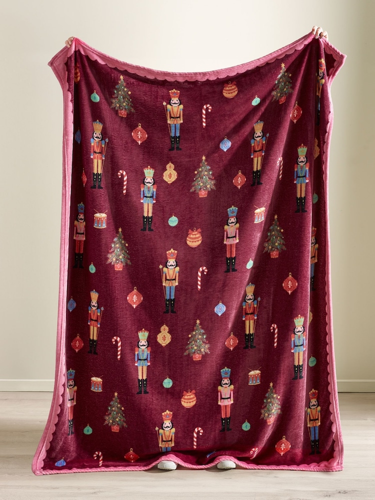 Catherine Lansfield Plum Teddy Christmas Nutcracker Cosy and Warm Fleece Throw - Image 2 of 3 Catherine Lansfield Plum Teddy Christmas Nutcracker Cosy and Warm Fleece Throw - Image 2 of 3