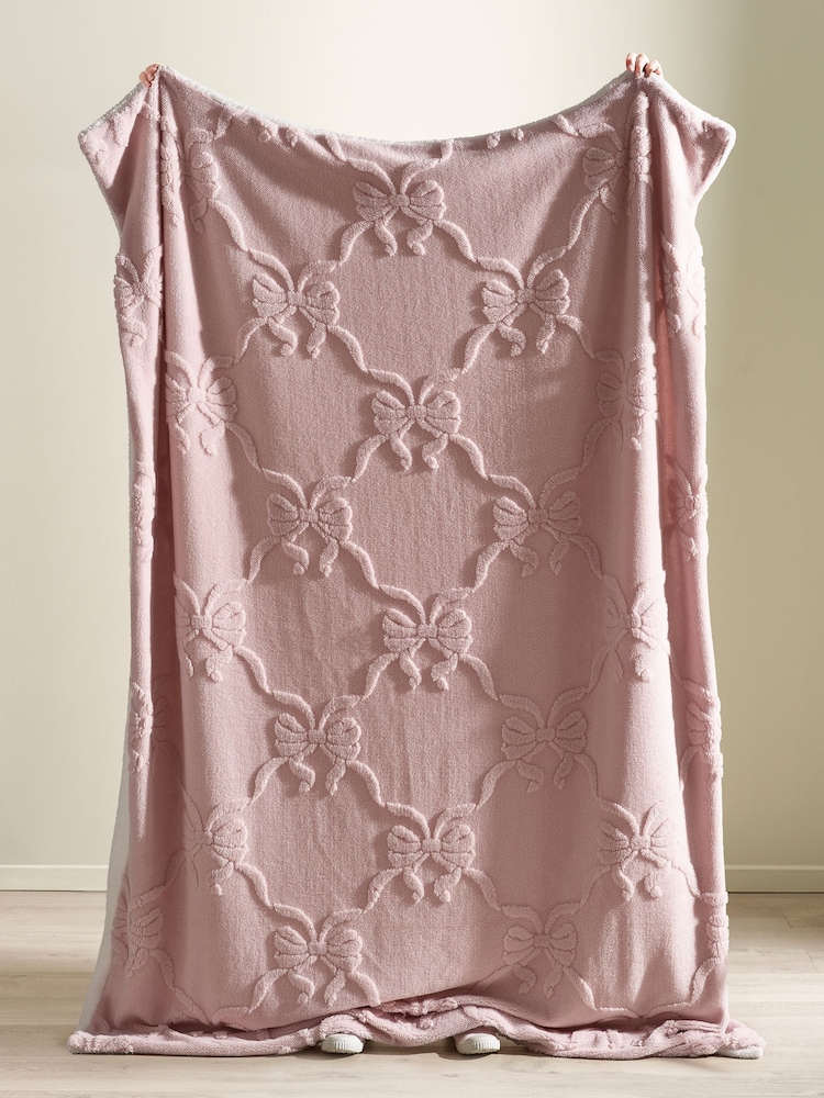 Catherine Lansfield Pink Carved Bow Cosy Fleece Blanket Throw - Image 2 of 3 Catherine Lansfield Pink Carved Bow Cosy Fleece Blanket Throw - Image 2 of 3
