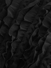 Schwarz - Langärmliger Pullover mit Rüschen und Zopfmuster - Bild 6 von 6