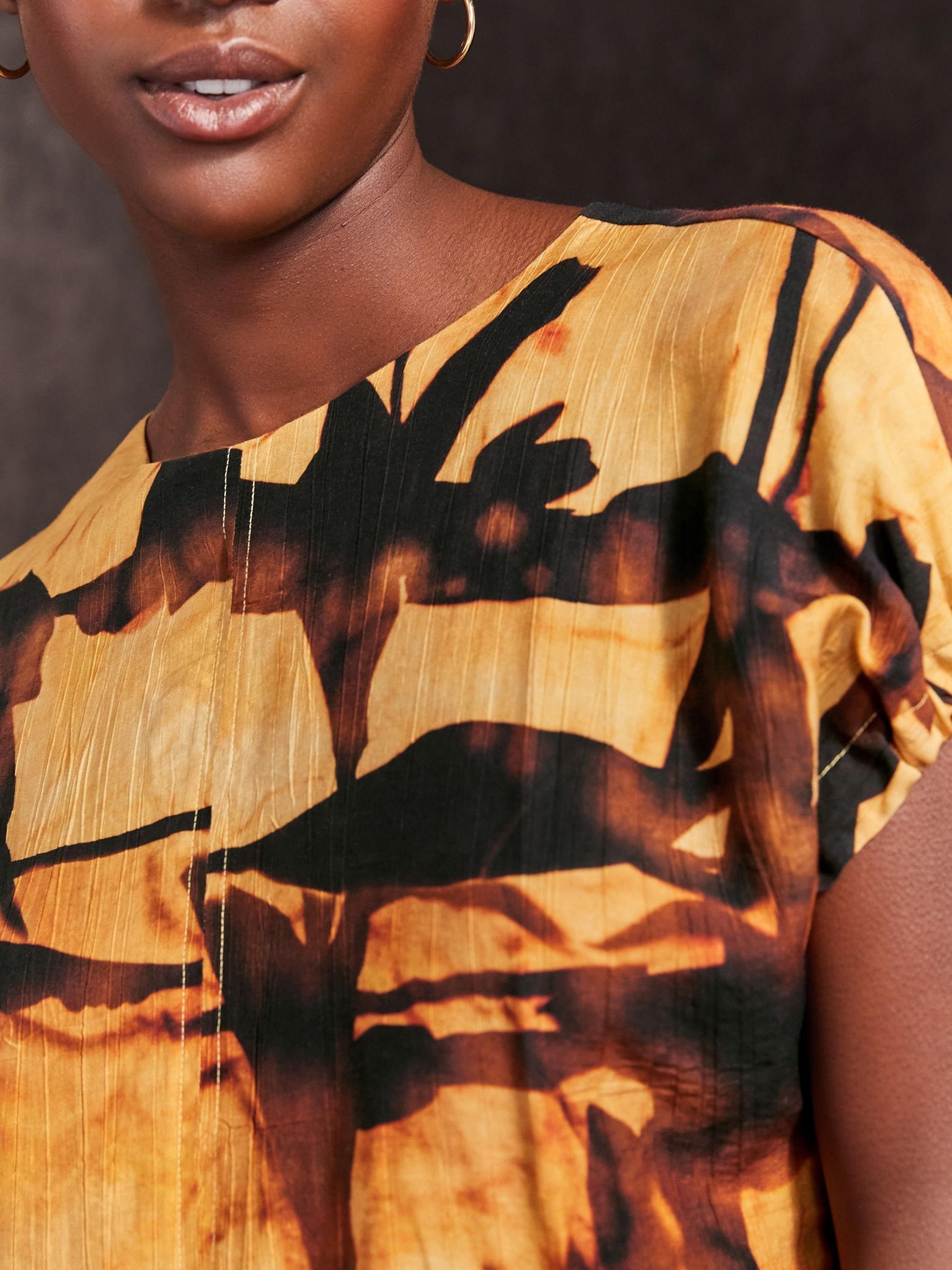 Yellow and black shirt dress top