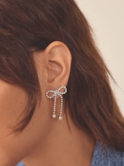 Silver Tone Sparkle Bow Earrings - Image 1 of 3
