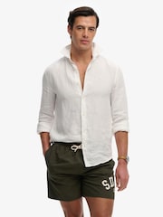 Superdry Green Printed Logo 16-Inch Swim Shorts - Image 1 of 8