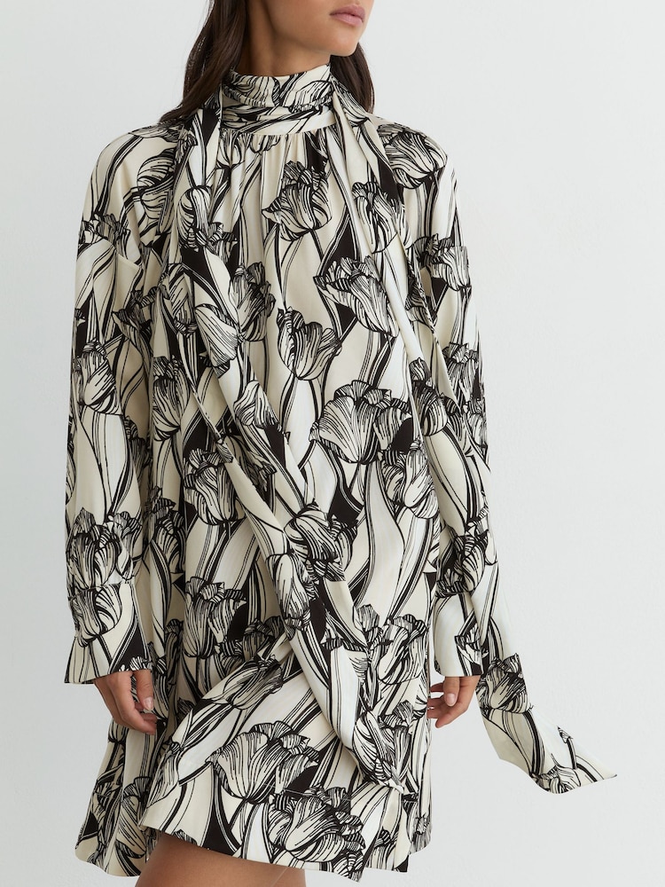 Reiss Black/Ivory Alwen Floral-Print Tie-Neck Swing Mini Dress - Image 1 of 7 Reiss Black/Ivory Alwen Floral-Print Tie-Neck Swing Mini Dress - Image 1 of 7
